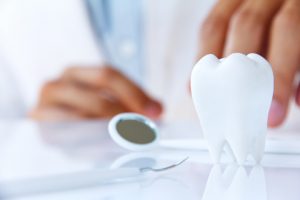 Dentist examing tooth